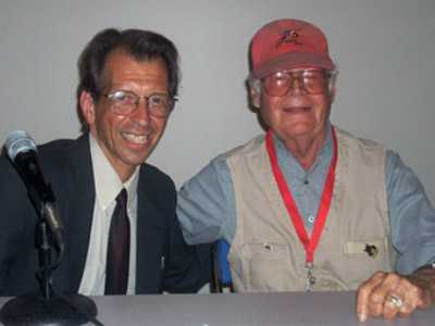 Lew Sayre Schwartz (R) with cartoonist Batton Lash at the 2009 Comic-Con in San Diego. Photo by Jackie Estrada.